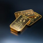 Gold slightly dropped against growing dollar