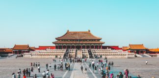 Chinese building with people around it