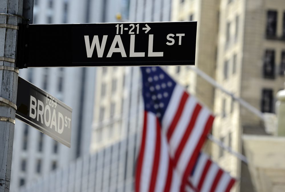 WallStreetSignWithFocusOnSignBlurredAmericanFlag | ForexMag Top 10 Finance Shows, Personal Finance Education, Investment TV Programs, Finance TV Shows