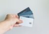 Credit cards, american, capital one, hand holding cards.