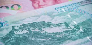 Close-up of a Chinese yuan banknote showing a historic fortress/Great Wall-style illustration and security patterns